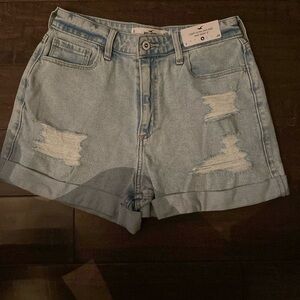 light wash 3” curvy high rise shorts with holes